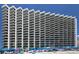 Beautiful exterior view of this oceanfront building with private balconies and ocean views at 1210 N Waccamaw Dr. # 408, Garden City Beach, SC 29576