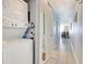 The hallway features a stacked washer and dryer set at 1210 N Waccamaw Dr. # 408, Garden City Beach, SC 29576