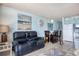 Open concept living room with ocean views, dining area, and adjacent kitchen is great for entertaining at 1210 N Waccamaw Dr. # 408, Garden City Beach, SC 29576