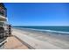 High-rise view from a condo balcony showcasing the beach and ocean waters, perfect for coastal living at 1210 N Waccamaw Dr. # 408, Garden City Beach, SC 29576