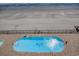 Aerial view of a sparking pool beside a sandy beach, perfect for relaxing getaways and enjoying ocean views at 1210 N Waccamaw Dr. # 408, Garden City Beach, SC 29576