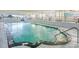 Indoor pool offers a serene setting with natural light and a unique underwater mural at 1210 N Waccamaw Dr. # 408, Garden City Beach, SC 29576