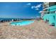 View of the community pool and beach, offering a relaxed and welcoming community for all at 1210 N Waccamaw Dr. # 408, Garden City Beach, SC 29576