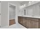 Modern bathroom with dual sink vanity, storage, and a view into walk-in closet at 1279 Safe Haven Dr., Myrtle Beach, SC 29579