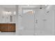 Bathroom showcases a tiled walk-in shower, rain shower head, and vanity with dark wood cabinets at 1279 Safe Haven Dr., Myrtle Beach, SC 29579