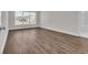 Bright, spacious bedroom featuring wood-look floors and a large window with neighborhood views at 1279 Safe Haven Dr., Myrtle Beach, SC 29579