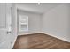 Bedroom featuring wood-look floors, neutral paint, and a window with views at 1279 Safe Haven Dr., Myrtle Beach, SC 29579