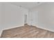 Bedroom showing entry to ensuite bathroom, closet, and wood-look floors at 1279 Safe Haven Dr., Myrtle Beach, SC 29579