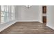 Dining room with hardwood floors, bright window, and elegant lighting at 1279 Safe Haven Dr., Myrtle Beach, SC 29579