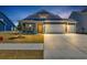 Charming home featuring a two-car garage, yellow door, and manicured lawn at 1279 Safe Haven Dr., Myrtle Beach, SC 29579