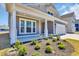 Home with a welcoming front porch, fresh landscaping, and a two-car garage at 1279 Safe Haven Dr., Myrtle Beach, SC 29579