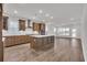 Open-concept kitchen with stainless hood, ample counter space, and a large island at 1279 Safe Haven Dr., Myrtle Beach, SC 29579