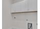 Well-lit laundry room with white cabinets and space for washer and dryer at 1279 Safe Haven Dr., Myrtle Beach, SC 29579