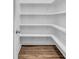 Spacious walk-in pantry with white shelves and wood-look flooring at 1279 Safe Haven Dr., Myrtle Beach, SC 29579