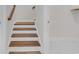 Wooden staircase with white risers leading to the upper level at 1279 Safe Haven Dr., Myrtle Beach, SC 29579