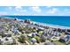 Stunning aerial view of colorful beach homes near the ocean and sandy beach on a beautiful sunny day at 134 Vista Dr., Murrells Inlet, SC 29576