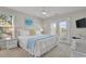 Bright bedroom with white wicker furniture and balcony access at 134 Vista Dr., Murrells Inlet, SC 29576