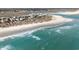 Breathtaking aerial view of a pristine beach with crystal-clear water and coastal homes at 135 Chapel Creek Rd. # 41, Pawleys Island, SC 29585