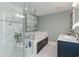 Elegant bathroom featuring marble shower and soaking tub, with large vanity and ample lighting at 135 Chapel Creek Rd. # 41, Pawleys Island, SC 29585
