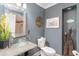 Stylish bathroom with blue walls, modern vanity, and decorative touches that create a serene space at 135 Chapel Creek Rd. # 41, Pawleys Island, SC 29585