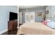 Comfortable bedroom featuring hardwood floors, a television, and access to a private balcony at 135 Chapel Creek Rd. # 41, Pawleys Island, SC 29585