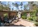 Enclosed brick courtyard featuring seating area, brick walls with greenery, and a decorative fountain at 135 Chapel Creek Rd. # 41, Pawleys Island, SC 29585