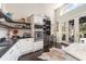 Modern kitchen with custom cabinetry, open shelving, stainless steel appliances, and access to the patio at 135 Chapel Creek Rd. # 41, Pawleys Island, SC 29585