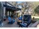 Inviting outdoor patio with brick pavers, fire pit, pergola, and comfortable Adirondack rocking chairs at 135 Chapel Creek Rd. # 41, Pawleys Island, SC 29585