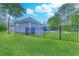 Fenced backyard featuring a beautiful pool and lush green grass, perfect for outdoor enjoyment at 138 Cooper River Rd., Myrtle Beach, SC 29588