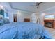 Spacious primary bedroom with hardwood floors, a fireplace, a flat-screen TV, and an attached bathroom at 138 Cooper River Rd., Myrtle Beach, SC 29588