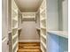 Spacious walk-in closet with custom shelving, hardwood floor, and ample storage space at 138 Cooper River Rd., Myrtle Beach, SC 29588