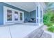 Relaxing front porch with bench seating and double glass doors at 138 Cooper River Rd., Myrtle Beach, SC 29588