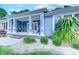 Inviting front porch with white columns and vibrant landscaping at 138 Cooper River Rd., Myrtle Beach, SC 29588