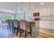 Modern kitchen with granite island, barstool seating, and pendant lighting at 138 Cooper River Rd., Myrtle Beach, SC 29588