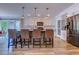 Modern kitchen with a granite island, stainless steel appliances, subway tile backsplash, and white shaker cabinets at 138 Cooper River Rd., Myrtle Beach, SC 29588