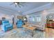 Bright and airy living room with fireplace, sofa, and accent chairs at 138 Cooper River Rd., Myrtle Beach, SC 29588