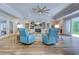 Spacious living room featuring a fireplace, stylish decor, and wood flooring at 138 Cooper River Rd., Myrtle Beach, SC 29588