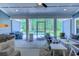 Relaxing screened-in patio with ceiling fan, comfortable seating and backyard pool view at 138 Cooper River Rd., Myrtle Beach, SC 29588