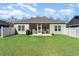 Well-maintained backyard featuring a screened-in porch and a privacy fence at 1470 Burriss Rd., Conway, SC 29526