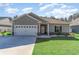 Beautiful home exterior with a two-car garage and manicured landscaping at 1470 Burriss Rd., Conway, SC 29526