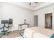 Bright main bedroom with a desk, and access to the ensuite bathroom through a white door at 1470 Burriss Rd., Conway, SC 29526