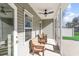 Relaxing screened porch with comfortable seating and a ceiling fan for outdoor enjoyment at 1470 Burriss Rd., Conway, SC 29526