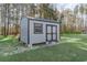 Storage shed in backyard with double doors and a window at 1470 Burriss Rd., Conway, SC 29526