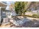Spacious backyard with partial concrete slab, white fence, mature trees, and low-maintenance landscaping at 1470 Turkey Ridge Dr. # D, Myrtle Beach, SC 29575