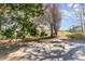 Backyard patio overlooking partial water view, mature trees, and natural landscape at 1470 Turkey Ridge Dr. # D, Myrtle Beach, SC 29575