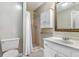 Bathroom featuring a shower, toilet, and white vanity with a framed mirror at 1470 Turkey Ridge Dr. # D, Myrtle Beach, SC 29575