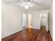 Cozy bedroom with dark wood-look floors, ceiling fan, and easy access to closet and bathroom at 1470 Turkey Ridge Dr. # D, Myrtle Beach, SC 29575