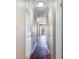Hallway with hardwood flooring and white paneled doors at 1470 Turkey Ridge Dr. # D, Myrtle Beach, SC 29575