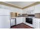 Charming kitchen boasts white cabinets, stainless steel appliances, and laminate countertops at 1470 Turkey Ridge Dr. # D, Myrtle Beach, SC 29575