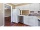 Functional kitchen with white cabinets, stainless steel dishwasher, and laminate countertops at 1470 Turkey Ridge Dr. # D, Myrtle Beach, SC 29575